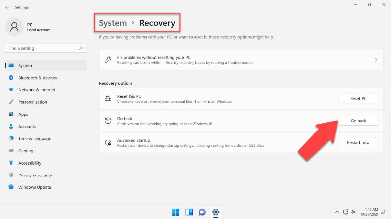 In the section “Recovery options” click “Go back”