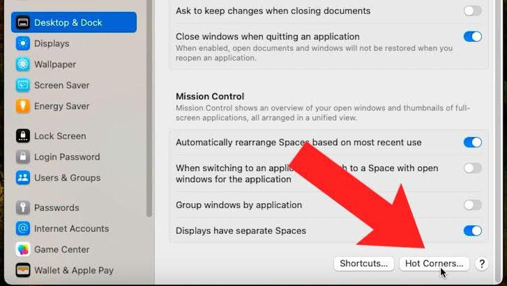 System Settings - Desktop & Dock - Hot Corners option